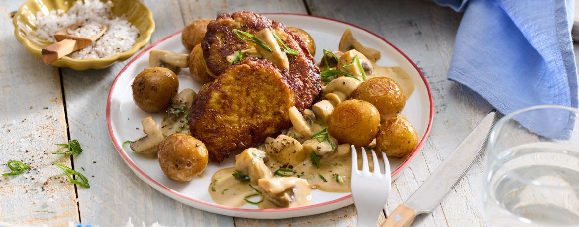 Schweineschnitzel in Ei-Senf-Hülle mit Honigkartoffeln und Rahmchampignons für 4 Personen von lidl-kochen.de